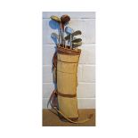 Vintage golf bag containing: two drivers and seven further various putters and irons by Forgan,