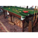 Mahogany framed quarter size snooker table, green baize inset raised on ring turned supports