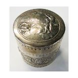 Hallmarked silver circular box, the pull-off cover embossed with a scene of fisherman fishing whilst