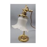 Early 20th century brass desk lamp, with frosted glass shade, raised on a circular base, approx