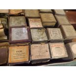 Three boxes: various vintage pianola rolls