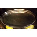 20th century silver on copper oval tray, the plain and polished field to a pierced gallery with