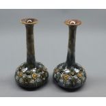 Pair of Royal Doulton stoneware stem vases, decorated with raised foliate design, numbered 3531 to