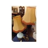 Mixed Lot: opaque glass based table lamp and a further turned wooden table lamp, both with tasselled