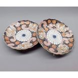 Pair of late 19th or early 20th century Japanese plates of frilled form decorated with panels of