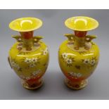 Pair of Japanese Satsuma earthenware vases of yellow ground decorated with cherry blossom, early