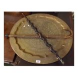 Mixed Lot: large circular brass Benares tray, and two walking sticks (3)
