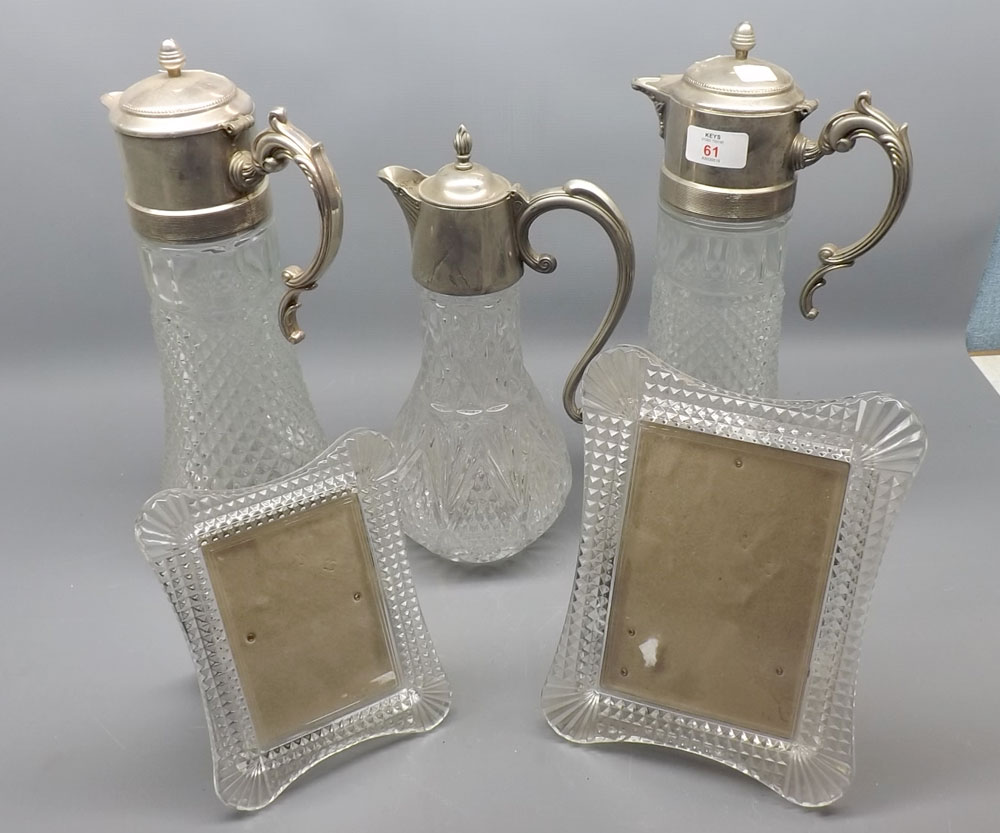 Mixed Lot: three clear glass and silver plated mounted jugs, together with two clear glass
