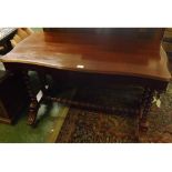 Victorian mahogany centre table of serpentined rectangular form, moulded edge over a plain frieze