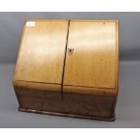 19th century light oak wedge-formed stationery cabinet, double doors opening to a fitted interior,