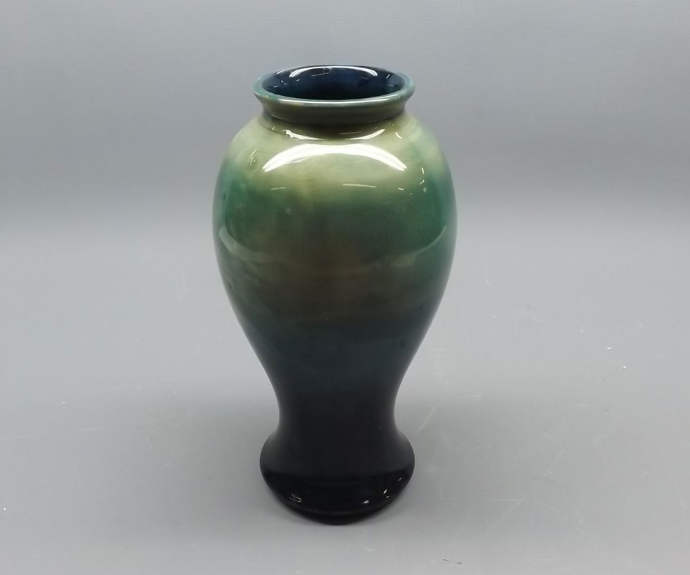 Moorcroft baluster vase, decorated in tones of turquoise, 9" high, impressed marks and signature