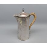 Arts & Crafts style silver plate on copper hot water jug, 9" high