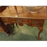 Victorian oak lowboy fitted with central drawer and dummy drawers either side, raised on cabriole