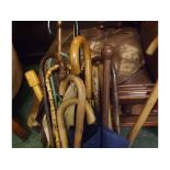 Collection of various vintage umbrellas, parasols and walking sticks (qty)