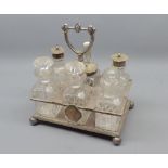 Silver plated and cut clear glass cruet stand, fitted with six bottles