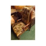 Victorian brown leather upholstered swept back armchair, raised on turned front legs and castors