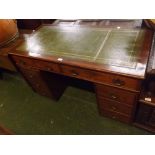 Late 19th century twin pedestal desk, the top inset with green leather, the body with two long and