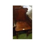 William IV mahogany hall chair with shield formed back, raised on fluted legs, (repaired to back)