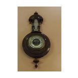 Late 19th or early 20th century aneroid barometer and thermometer combination, in foliate carved