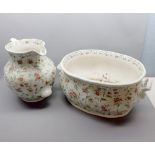 Large floral decorated double handled foot bath and accompanying jug