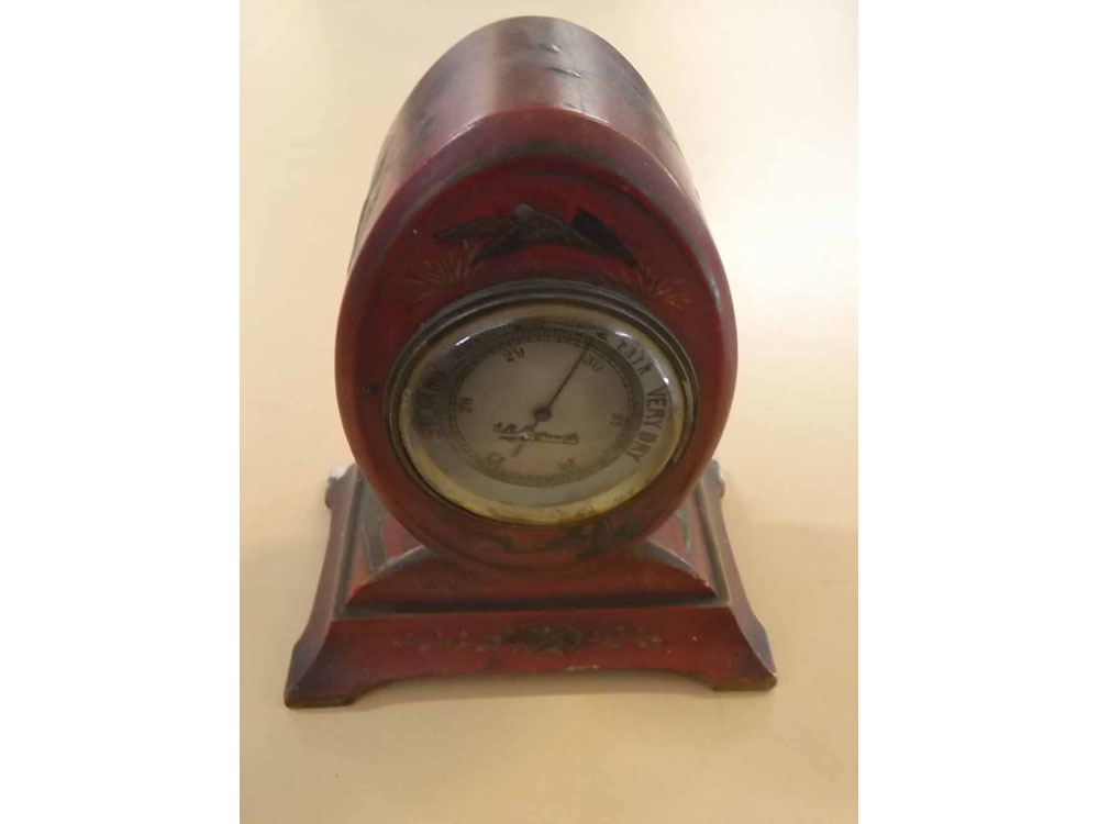 Small early 20th century aneroid barometer in red chinoiserie style case, 6 high