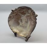 Unusual 20th century carved mother-of-pearl clam shell plaque, of an angel with children, raised on