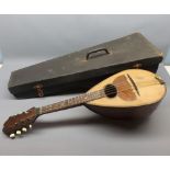 Cased early 20th century hardwood mandolin, unsigned, 24 long