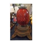 Victorian cast iron based pulpit lamp with cranberry shade, 23" high