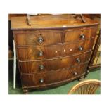 Victorian mahogany bow front chest of two short and three long drawers with turned knob handle,