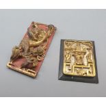 Two oriental gilded wall plaques, one modelled as a dragon, 10" and 7" high