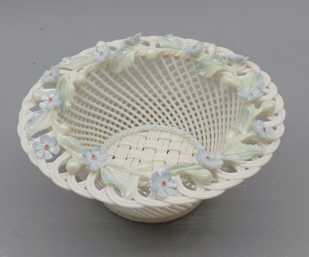 Belleek circular lattice ware bowl, the rim encrusted with coloured foliage, impressed mark, 6"