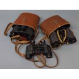 Three pairs of vintage binoculars (two in cases)