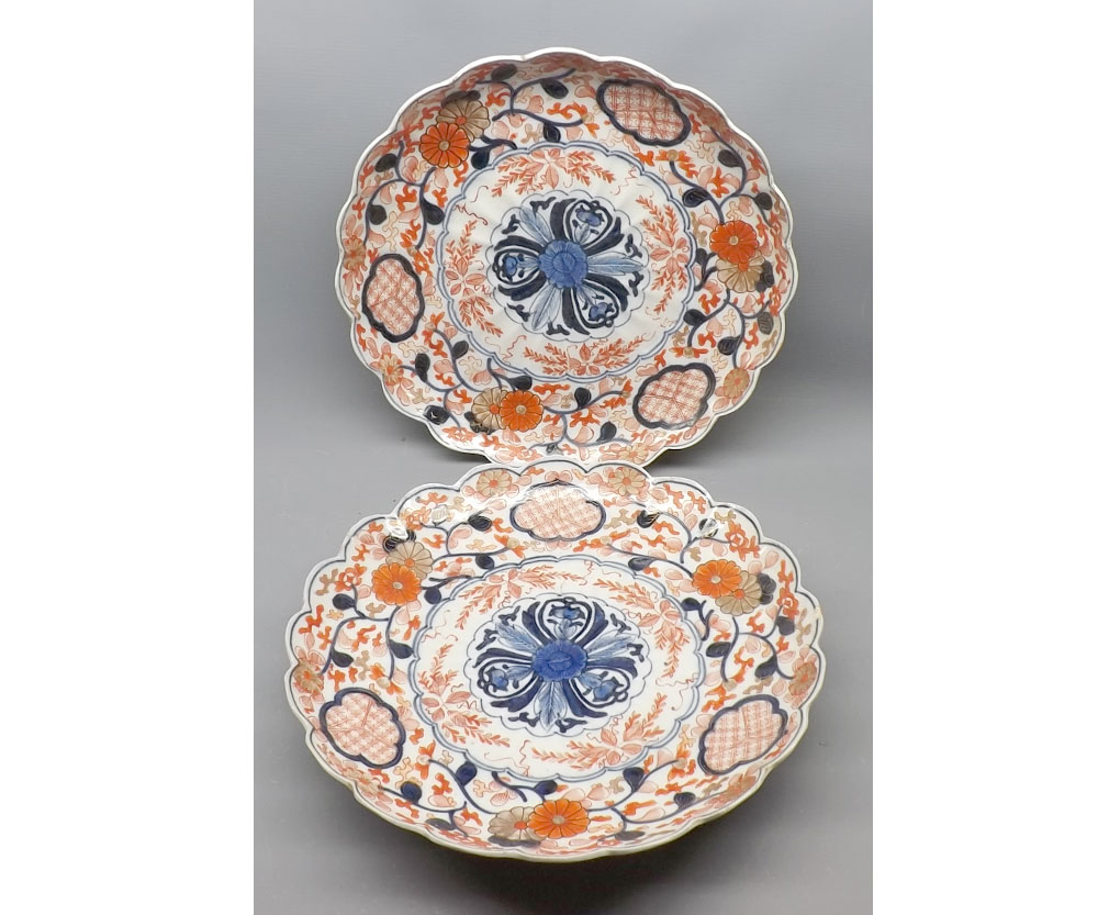 Pair of Japanese Imari circular dishes, with hipped rims, typically decorated, 12" diameter