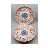Pair of Japanese Imari circular dishes, with hipped rims, typically decorated, 12" diameter