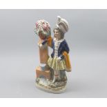 Staffordshire model of a figure beside a fountain, 10 1/2" high