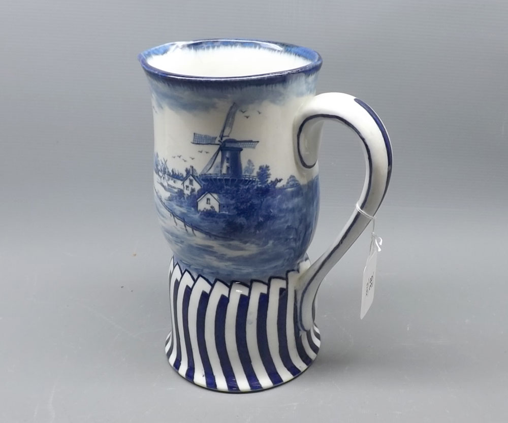 Doulton Burslem Norfolk jug, of waisted form, typically decorated in blue, 8 3/4" high