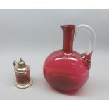 Cranberry jug with clear hand (no stopper), together with a further cranberry and silver plated