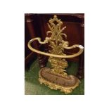 Gilt painted cast metal stick stand, 16" wide