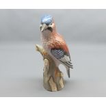 Large Continental model of a Jay on tree trunk base, (beak is repaired), 10 1/2" high