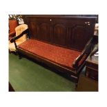 Large 19th century oak settle, the four panelled back over a base with short cabriole legs and later