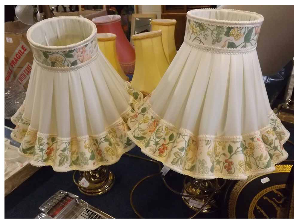 Pair of brass based table lamps, with floral frilled shades