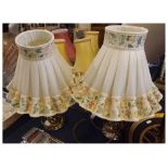 Pair of brass based table lamps, with floral frilled shades