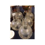 Collection of five vintage glass lamp chimneys, 9" high