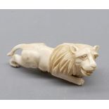 Oriental ivory carved model of a lion, 5" long