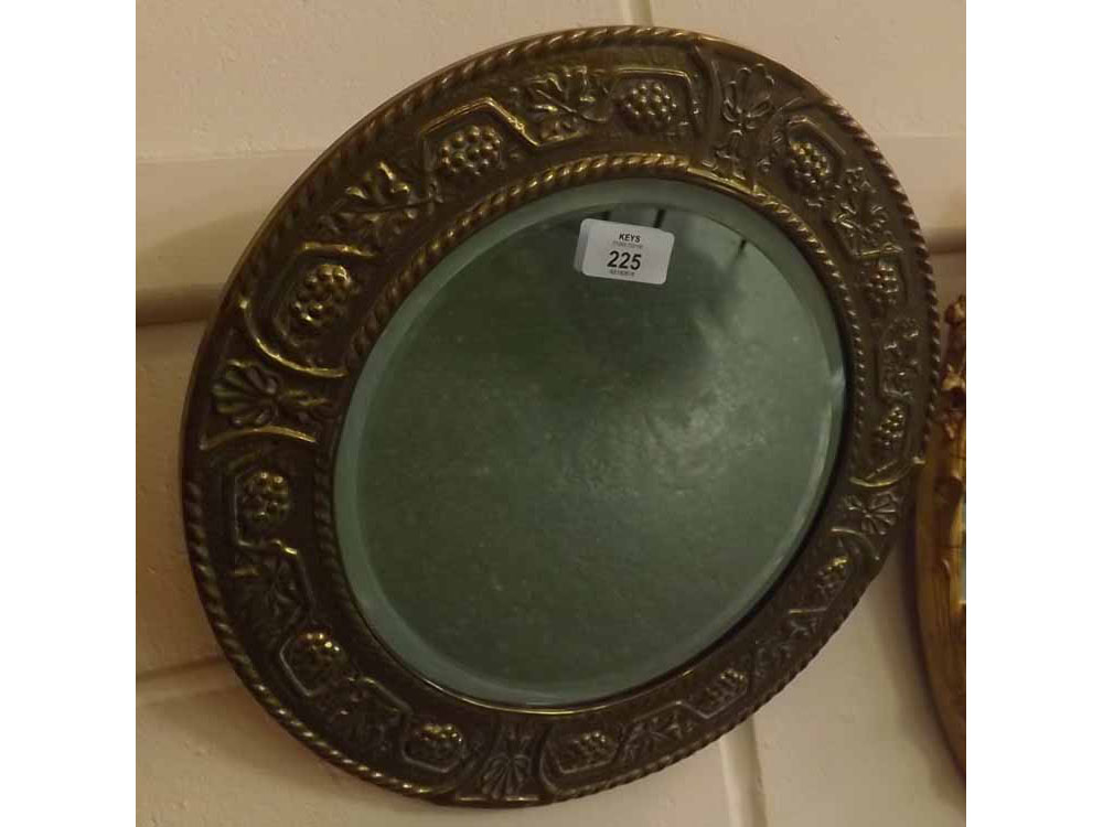 Small circular bevelled wall mirror in brass vine decorated frame, 14" diameter