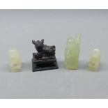 Mixed Lot: four various oriental hardstone or jadeite figures, animals including dogs of fo
