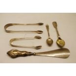 Mixed Lot: pair of George III sugar tongs, crested, together with a further 20th century pair, two