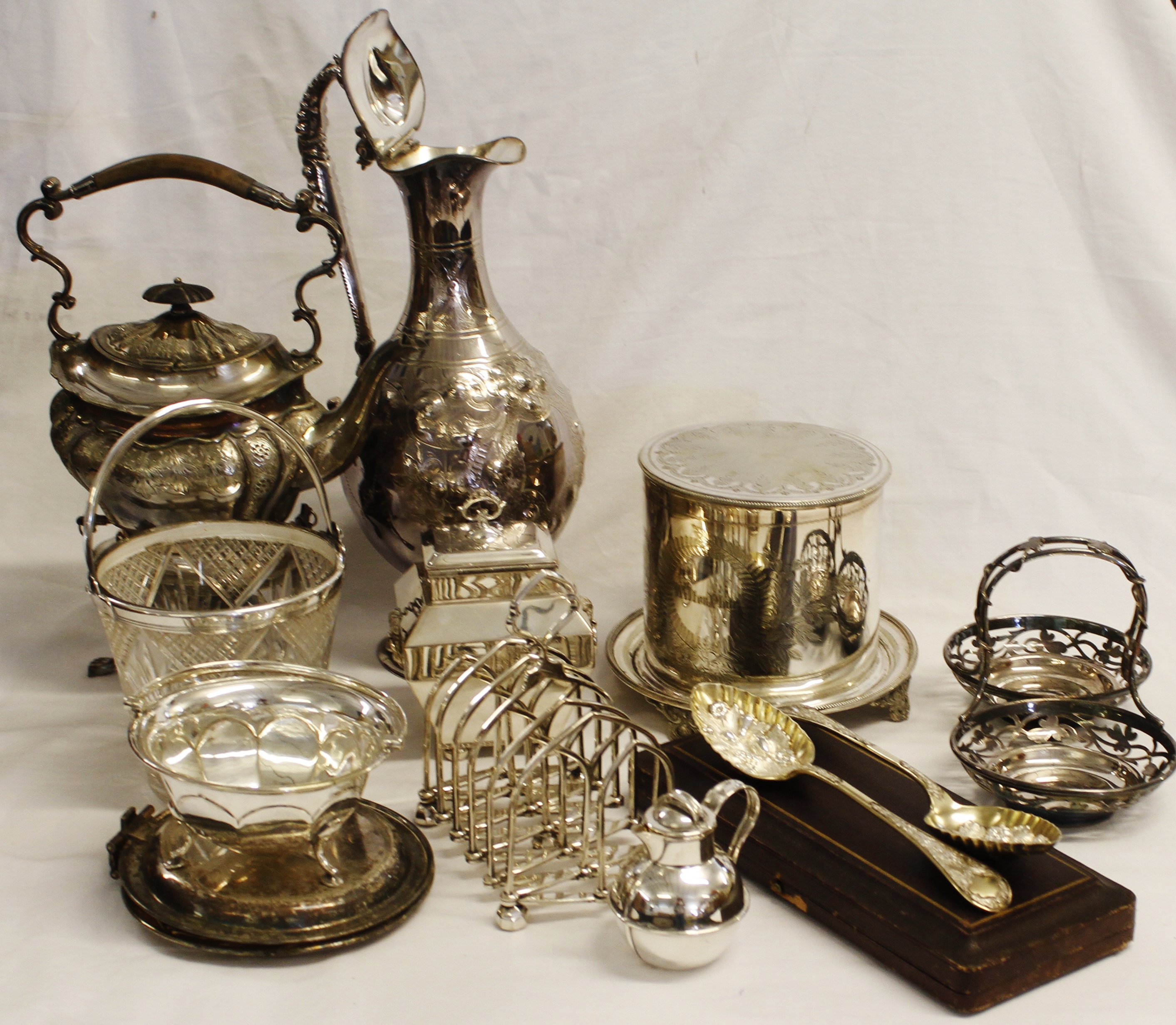 Mixed Lot of electroplated table wares: lidded ewer, tea kettle on stand, ice bucket, biscuit