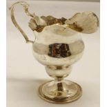 Late Victorian milk jug, of inverted baluster form with cut card rim and cast and applied leaf-