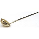 White metal and whalebone handled toddy ladle, the circular bowl with crimped rim (splits and